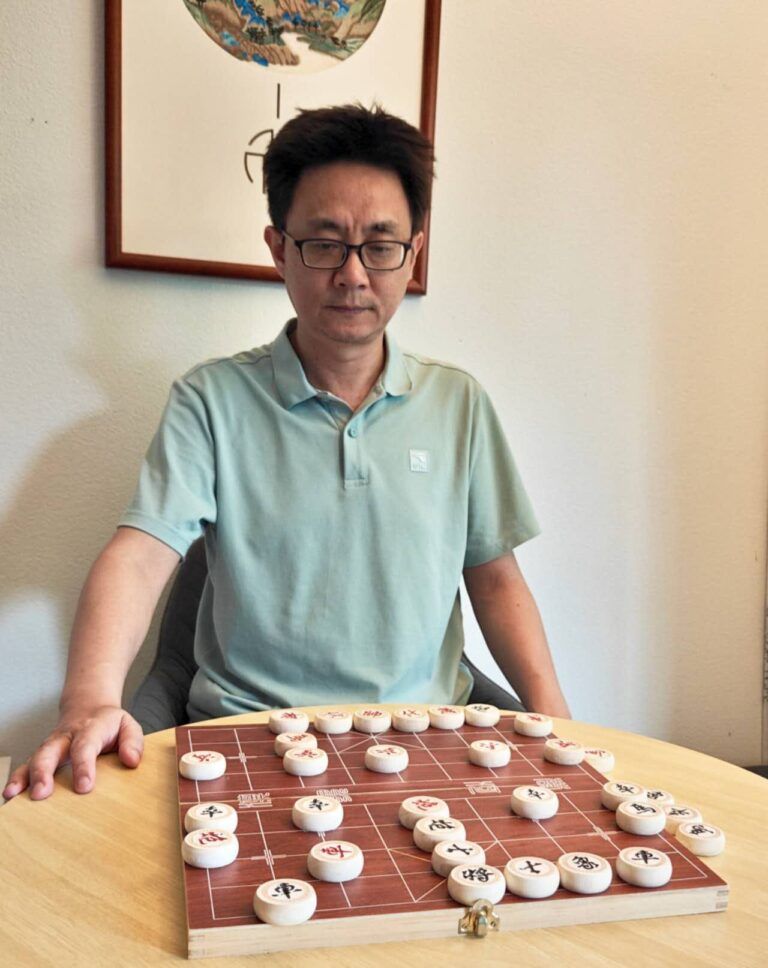 Weiqing Huang